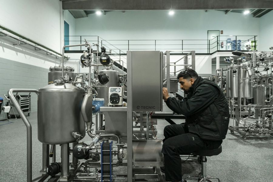 Operator monitoring machines on the factory floor